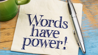 Words have power - handwriting on a napkin with cup of coffee